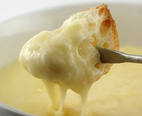 Bread Dipped in Melted Cheese